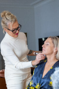 Alyson Hoag leading the Image Journey Makeup Experience in Atlanta at Authentic Beauty, helping a client reconnect with her reflection.