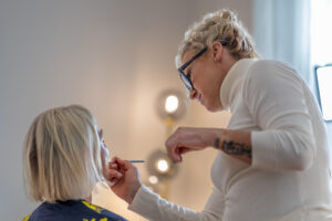 Alyson Hoag guiding a client through the Image Journey makeup experience at Authentic Beauty Makeup Salon & Brow Studio in Atlanta.