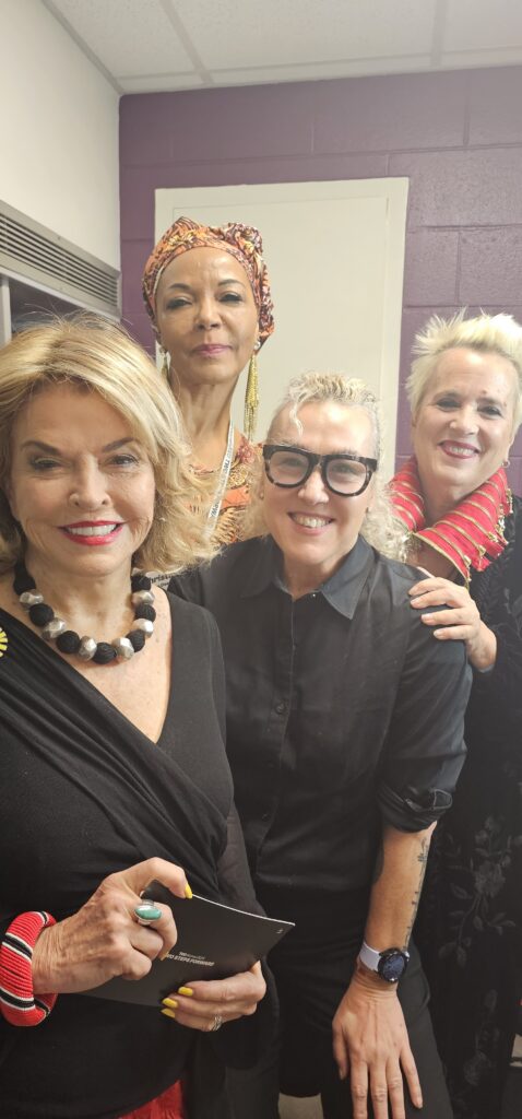 Pat Mitchell, Alyson Hoag of Authentic Beauty Makeup Salon & Brow Studio, and friends gathered backstage.
